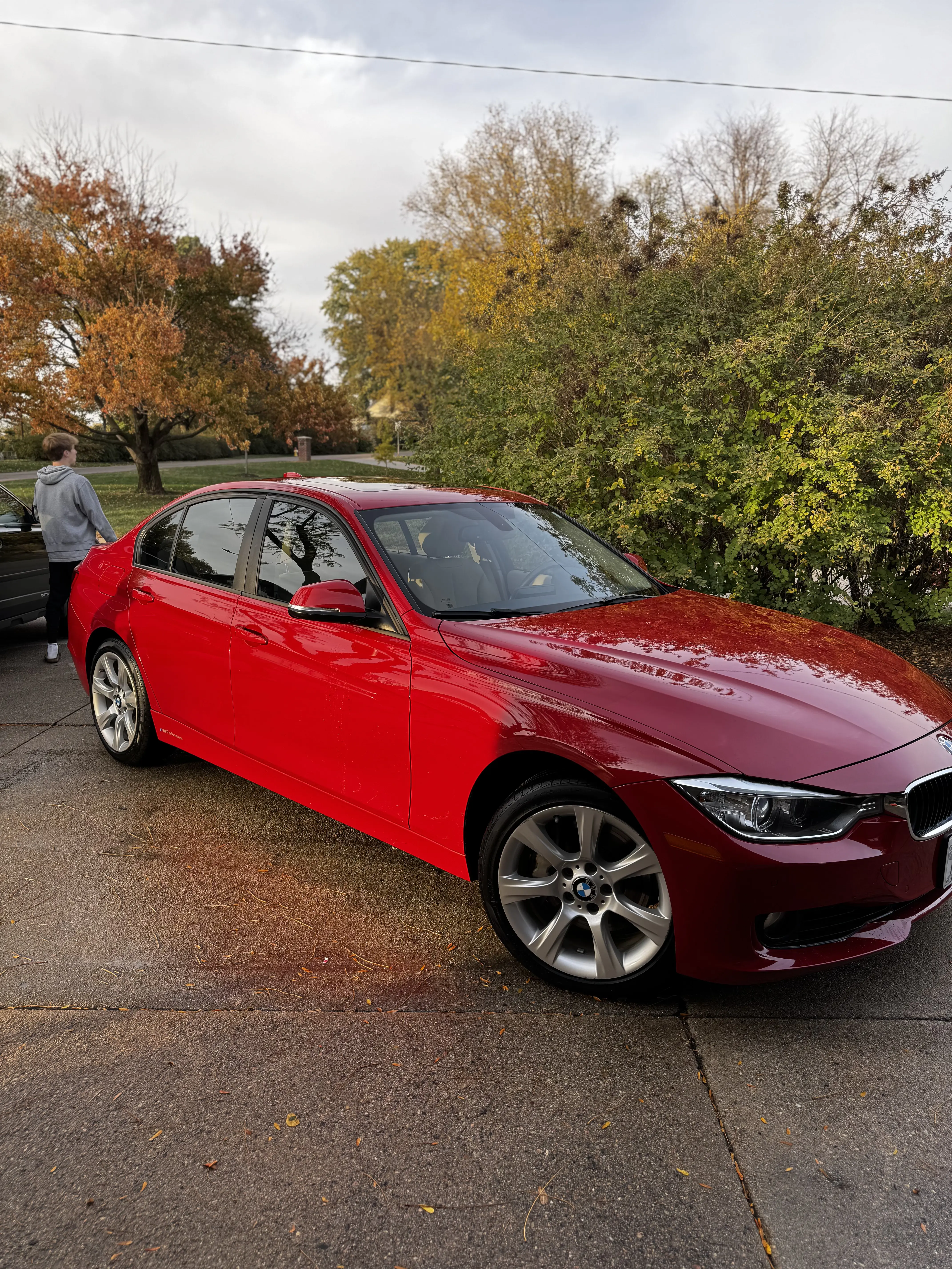 Ceramic coating on red BMW sedan - Signature Auto Detailing