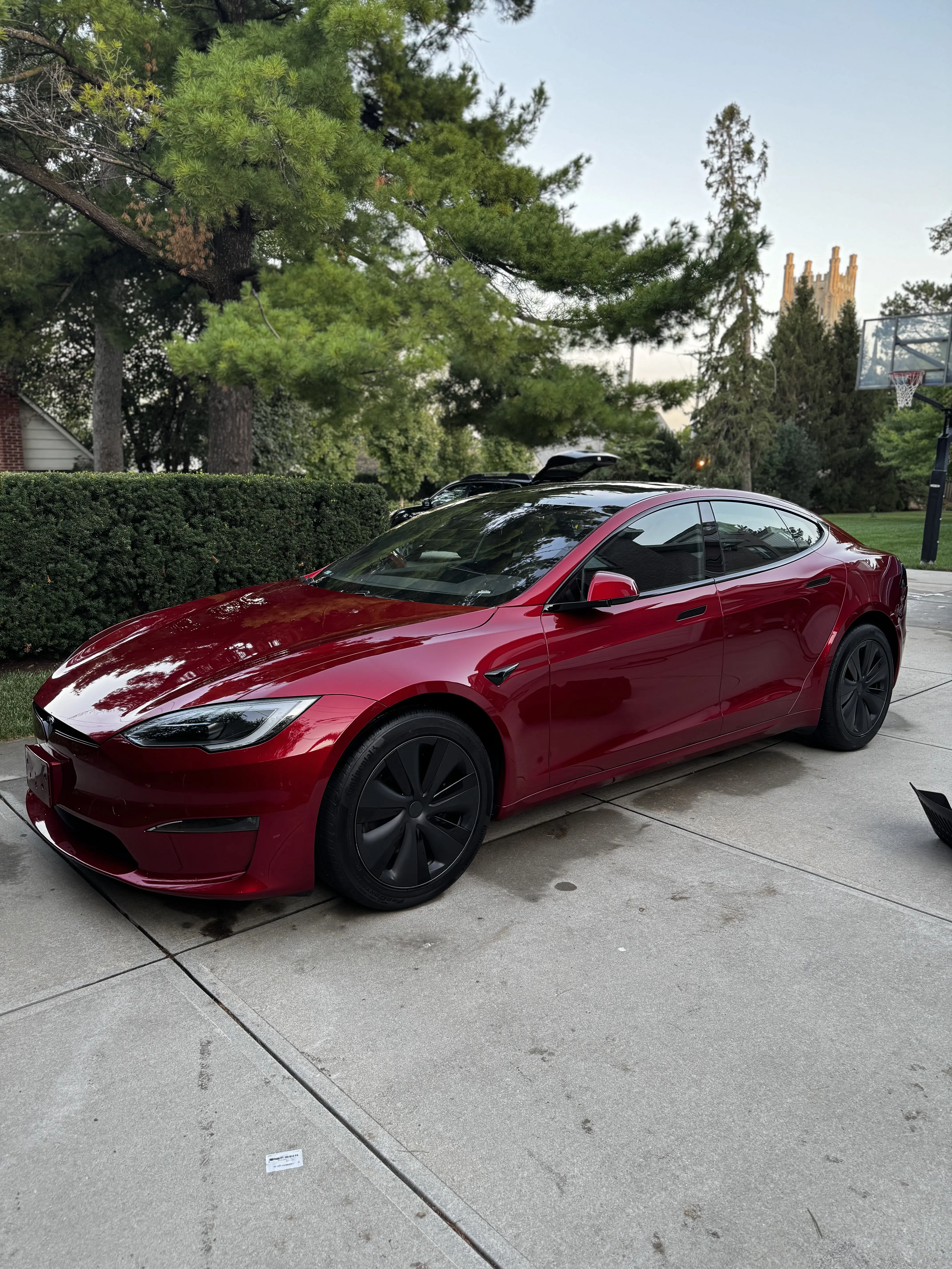 Exterior detailing of red Tesla - Signature Auto Detailing