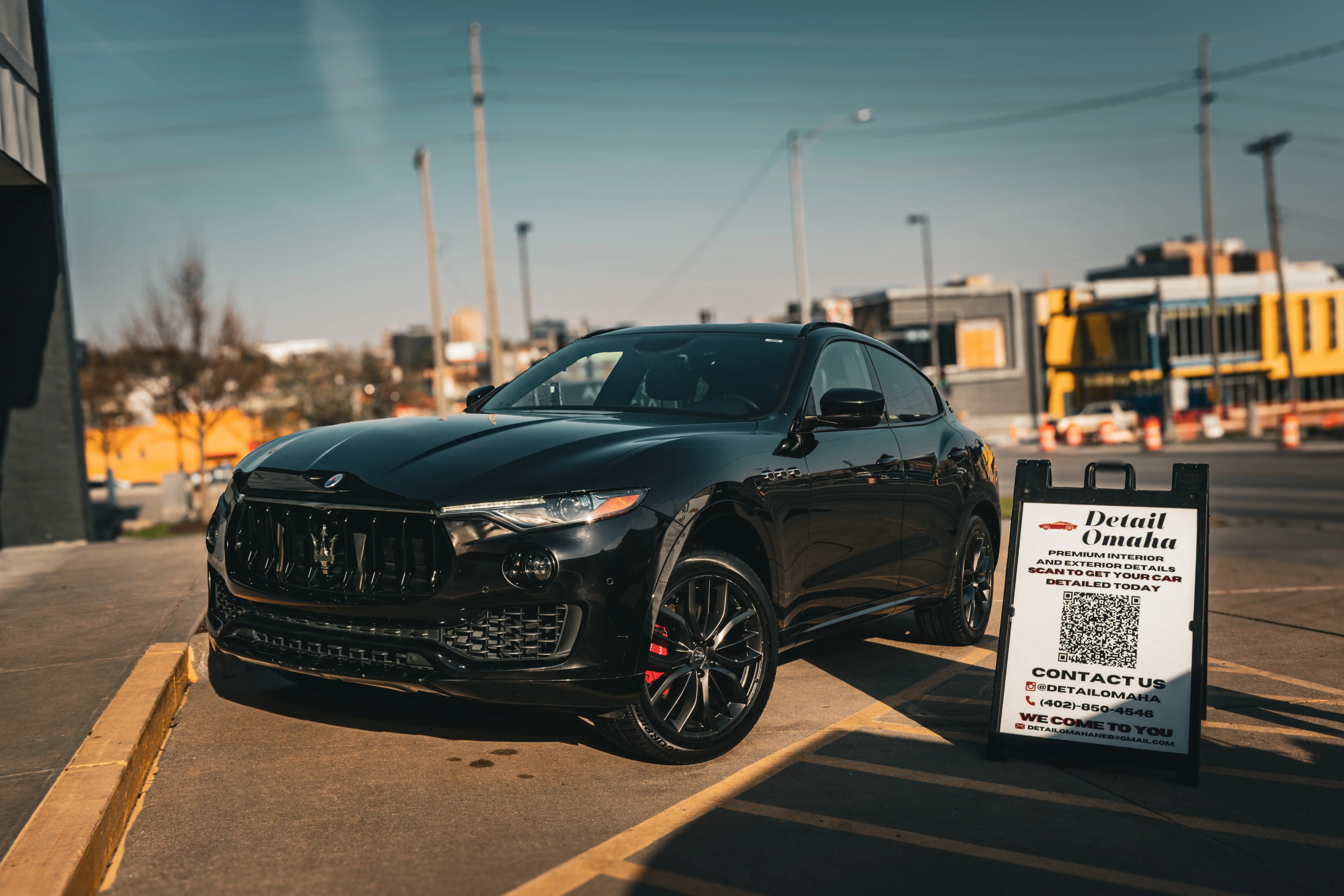 Exterior detailing of black Maserati SUV - Signature Auto Detailing